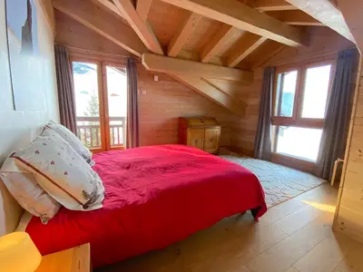 Un ou plusieurs lits dans un hébergement de l'établissement Chalet Kiriolé