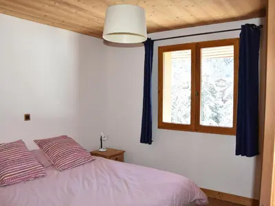 Un ou plusieurs lits dans un hébergement de l'établissement Appartement chalet 4 pièces, proche centre, animaux admis - FR-1-464-214