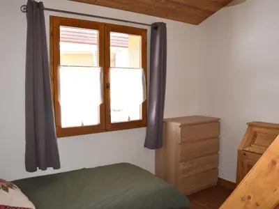 Un ou plusieurs lits dans un hébergement de l'établissement Appartement chalet 4 pièces, proche centre, animaux admis - FR-1-464-214