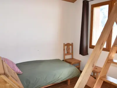 Un ou plusieurs lits dans un hébergement de l'établissement Appartement chalet 4 pièces, proche centre, animaux admis - FR-1-464-214