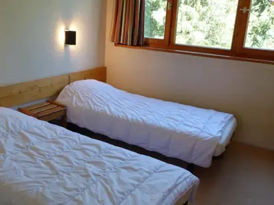 Un ou plusieurs lits dans un hébergement de l'établissement Appartement 3 pièces 7 personnes avec terrasse et Wifi, Les Arcs 1800, Villards - FR-1-411-395