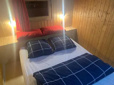 Un ou plusieurs lits dans un hébergement de l'établissement Le p'tit coin montagne 2
