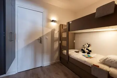 Un ou plusieurs lits dans un hébergement de l'établissement Appartement Arc 2000 Rénové 5 personnes Paradiski