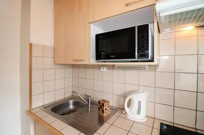 Cuisine ou kitchenette dans l'établissement Résidence Pontet B - 2 pièces au pied des pistes - quartier du Lavachet MAE-7164
